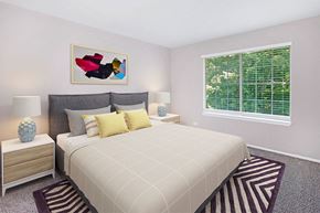 Schaumburg apartment for rent - a bedroom with a bed and a window