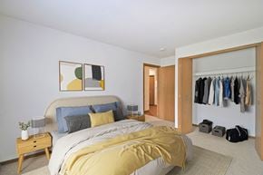 Livonia apartment for rent - bedroom with bed and nightstand and a wide closet