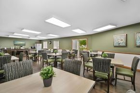 Livonia apartment for rent - a large dining room with tables and chairs and chairs