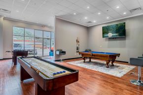 Pikeville apartment for rent - A room with a pool table and a billiard table.