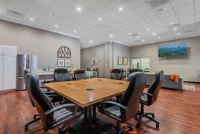 Pikeville apartment for rent - A conference room with a large table surrounded by chairs.