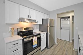 Kalamazoo apartment for rent - a kitchen with stainless steel appliances and white cabinets