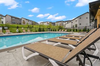 Poolside sundeck with chaise lounges