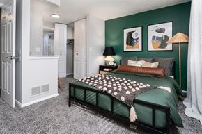 Amelia townhouse for rent - bedroom with a large bed and a closet