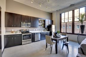 St. Paul apartment for rent - A modern kitchen with a dining table and chairs.