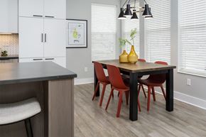 Cincinnati apartment for rent - A kitchen with a table and chairs.