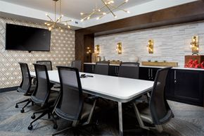 Cincinnati apartment for rent - A conference room with a long table and chairs.