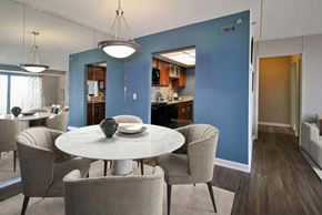 Detroit apartment for rent - A dining room with a round table and chairs.