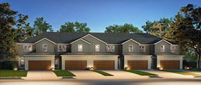 Lakeville apartment for rent - A large, two-story house with a dark grey exterior and a black roof.