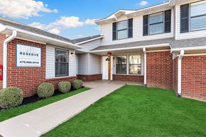 Bentonville apartment for rent - A building with a sign that says Reserve on it.