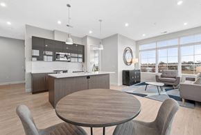 Cleveland apartment for rent - A modern kitchen with a dining table and chairs.
