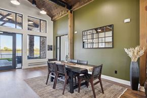 Kenosha apartment for rent - a dining room with a wooden table and chairs