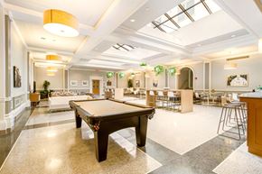 Detroit apartment for rent - A spacious room with a pool table in the center.