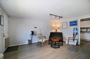 Ann Arbor apartment for rent - A living room with a sofa, two chairs, and a coffee table.