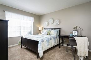 Cincinnati apartment for rent - a bedroom with a bed and a desk