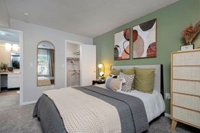 Centerville apartment for rent - a bedroom with green walls and a bed