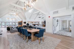 Centerville apartment for rent - a dining room with a wooden table and blue chairs