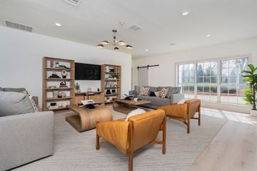 Centerville apartment for rent - a living room with couches and chairs and a television