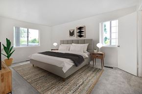 Saginaw apartment for rent - a bedroom with a bed and two windows