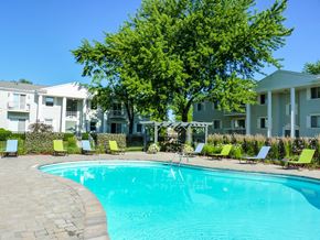 Saginaw apartment for rent - a large swimming pool in front of an apartment building