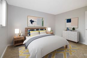Saginaw apartment for rent - a bedroom with a bed and a dresser