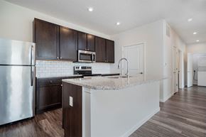Grove City apartment for rent - a kitchen with a counter top and a refrigerator