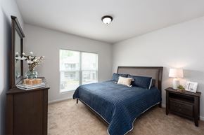 Fenton apartment for rent - a bedroom with a bed and a window