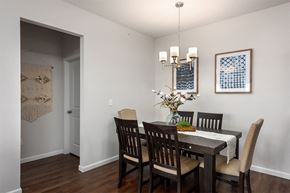 Fenton apartment for rent - a dining room with a table and chairs