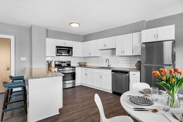 Cleveland apartment for rent - A modern kitchen with a dining table set for two.