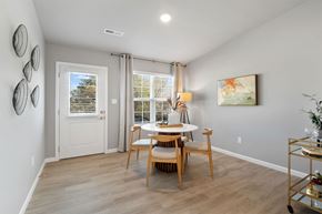 Ofallon apartment for rent - the dining room of a home with a table and chairs