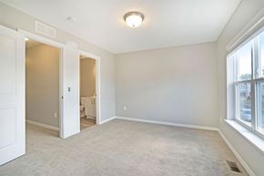 Grand Rapids apartment for rent - A spacious room with a carpeted floor and a window on the right side.