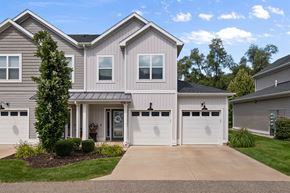 Grand Rapids apartment for rent - A two-story house with a garage and a driveway.