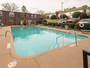 Little Rock apartment for rent - A small pool with a brownish tiled edge.