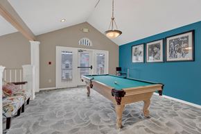 Canton apartment for rent - A pool table in a room with a carpeted floor.