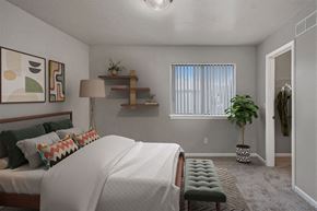 Portage apartment for rent - a bedroom with a large bed and a window