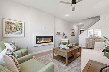 Victoria apartment for rent - A living room with a fireplace and a painting on the wall.