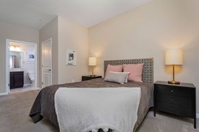 Columbus apartment for rent - a bedroom with a bed and a door to a bathroom