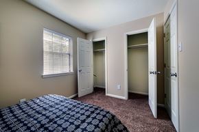 Little Rock apartment for rent - A bedroom with a bed and a window.