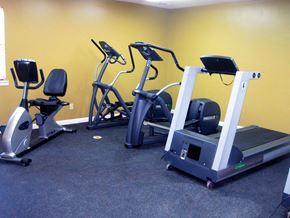 Little Rock apartment for rent - A gym with a treadmill, elliptical trainer and a recumbent bike.