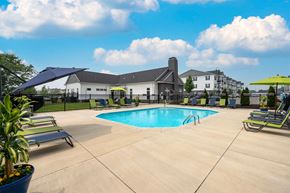 Grove City apartment for rent - our apartments have a large swimming pool with chairs and umbrellas