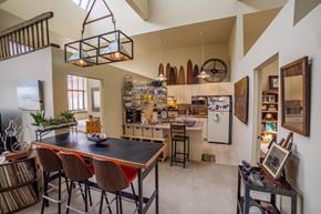 South Bend apartment for rent - A kitchen with a table and chairs in the middle of the room.