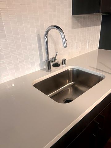 St. Paul apartment for rent - A modern kitchen sink with a chrome faucet.