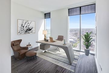 Cleveland apartment for rent - A modern living room with a brown chair and a grey sofa.
