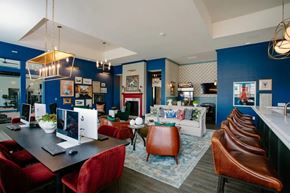Columbus apartment for rent - A modern dining room with a long table and chairs.