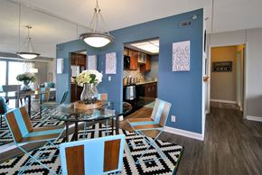 Detroit apartment for rent - a dining room and kitchen with a glass table and chairs