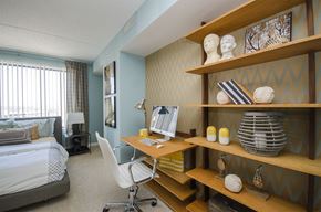 Detroit apartment for rent - a bedroom with a desk with a computer and a bed