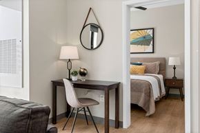 Cleveland apartment for rent - a bedroom with a bed and a desk in a room