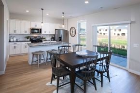 Albertville apartment for rent - a dining area with a table and chairs and a kitchen in the background