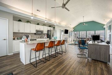 Portage apartment for rent - a kitchen and living room with a bar and chairs