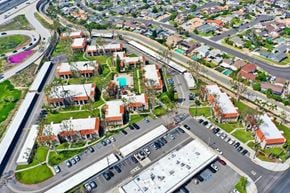 Fountain Valley apartment for rent - A bird's eye view of a residential area with houses and a parking lot.
